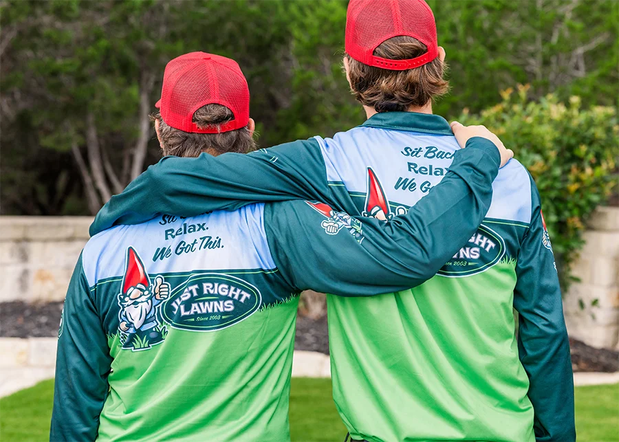 Teammates with arms around shoulders